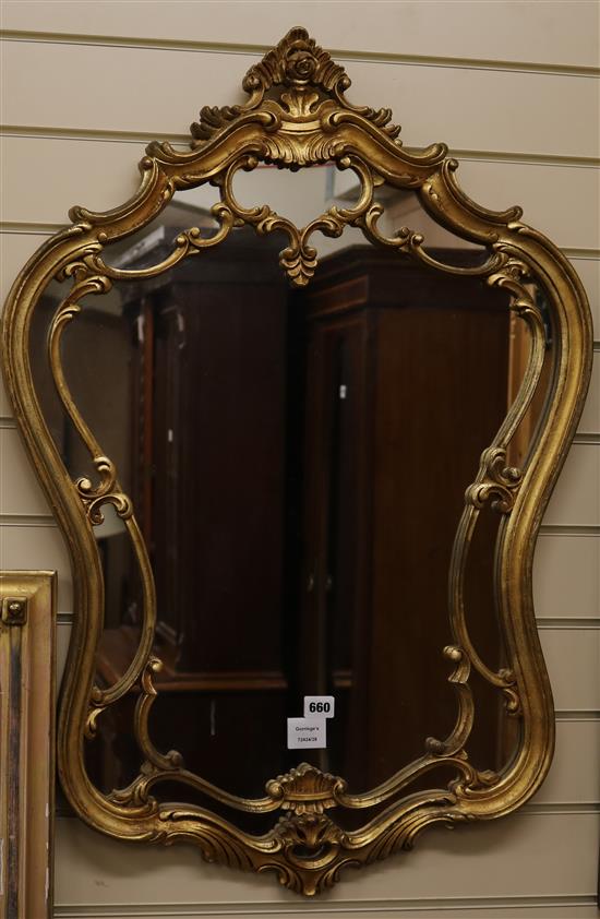 A cartouche shaped gilt wall mirror, H.90cm